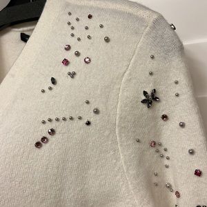Cardigan with gorgeous rhinestones and pearl details.